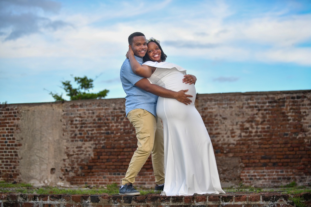 Maternity — Couple by the Fort Wall